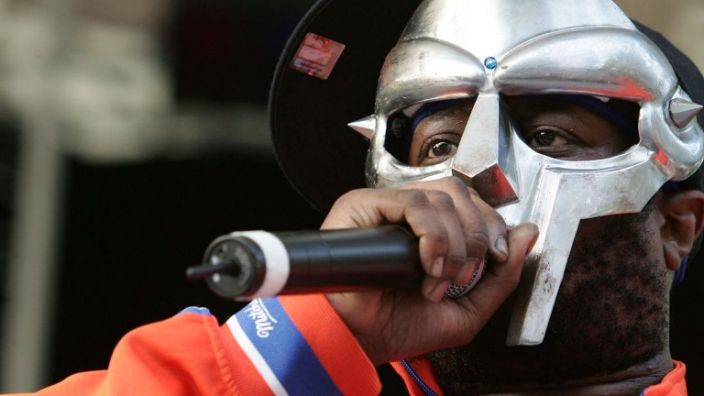 In this June 2005 photo, rapper MF DOOM performs at the Rhino Foundation Benefit Concert at Rumsey Playfield in Central Park in New York City.  His wife announced on Instagram that the MC had passed away in October.  (Photo by Peter Kramer / Getty Images)